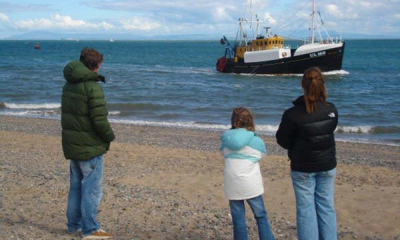 Watching the family fishing vessel