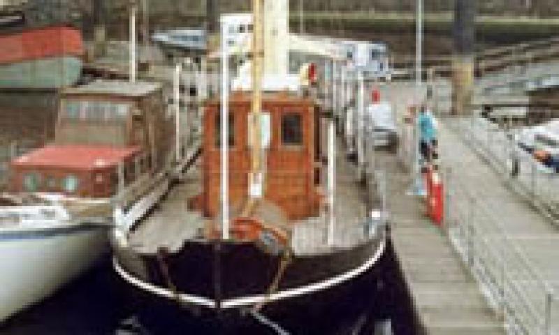 Photo of SY Carola moored at the pontoon at the Scottish Maritime Museum. Taken from bow looking along deck to stern. Ref: 1995/9/3/24