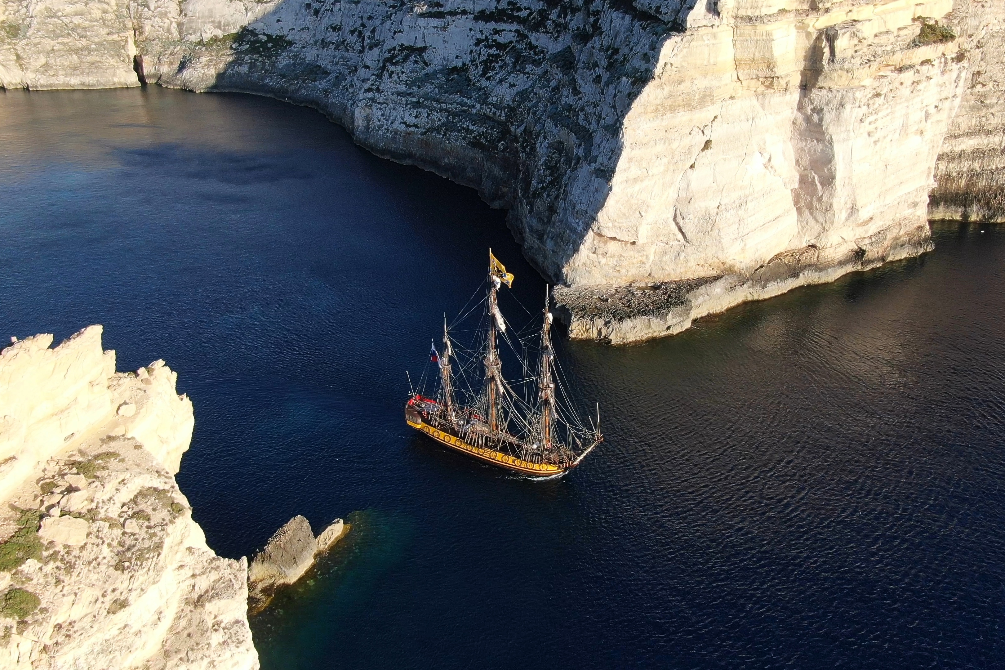 April 2020 Calendar image - Shtandart leaving the Pirate Bay of Gozo by Paula Lenz