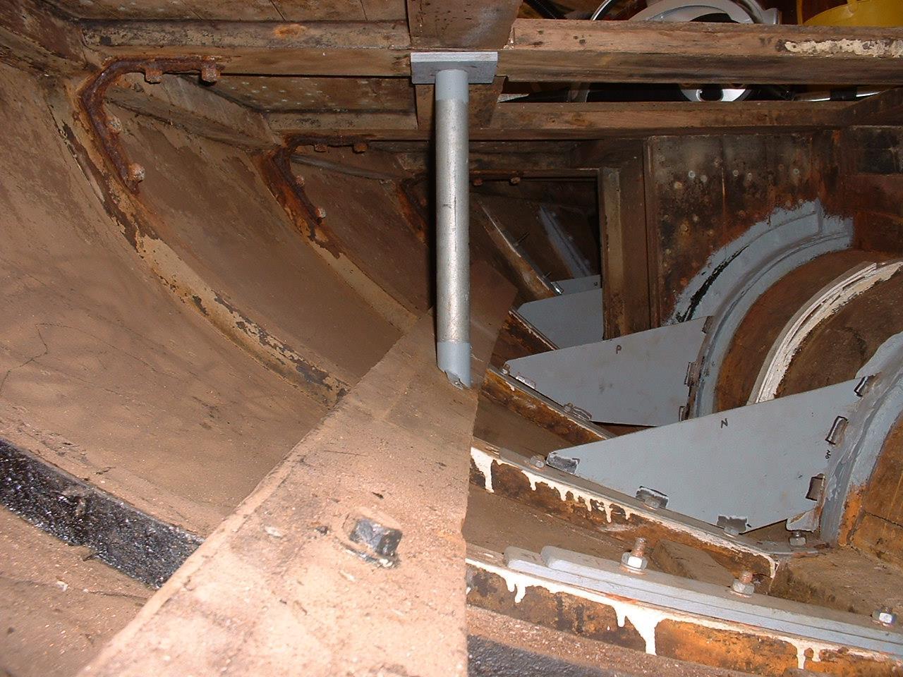 The floors and deck support shown in Fig.3 now removed and replaced with mild steel plate coated with epoxy primer. The threaded end of the new galvanised bolts can be seen. Once the new plates have been welded to the original remaining sections around the tunnel, they will again receive numerous coatings of epoxy primer, undercoat and topcoat.