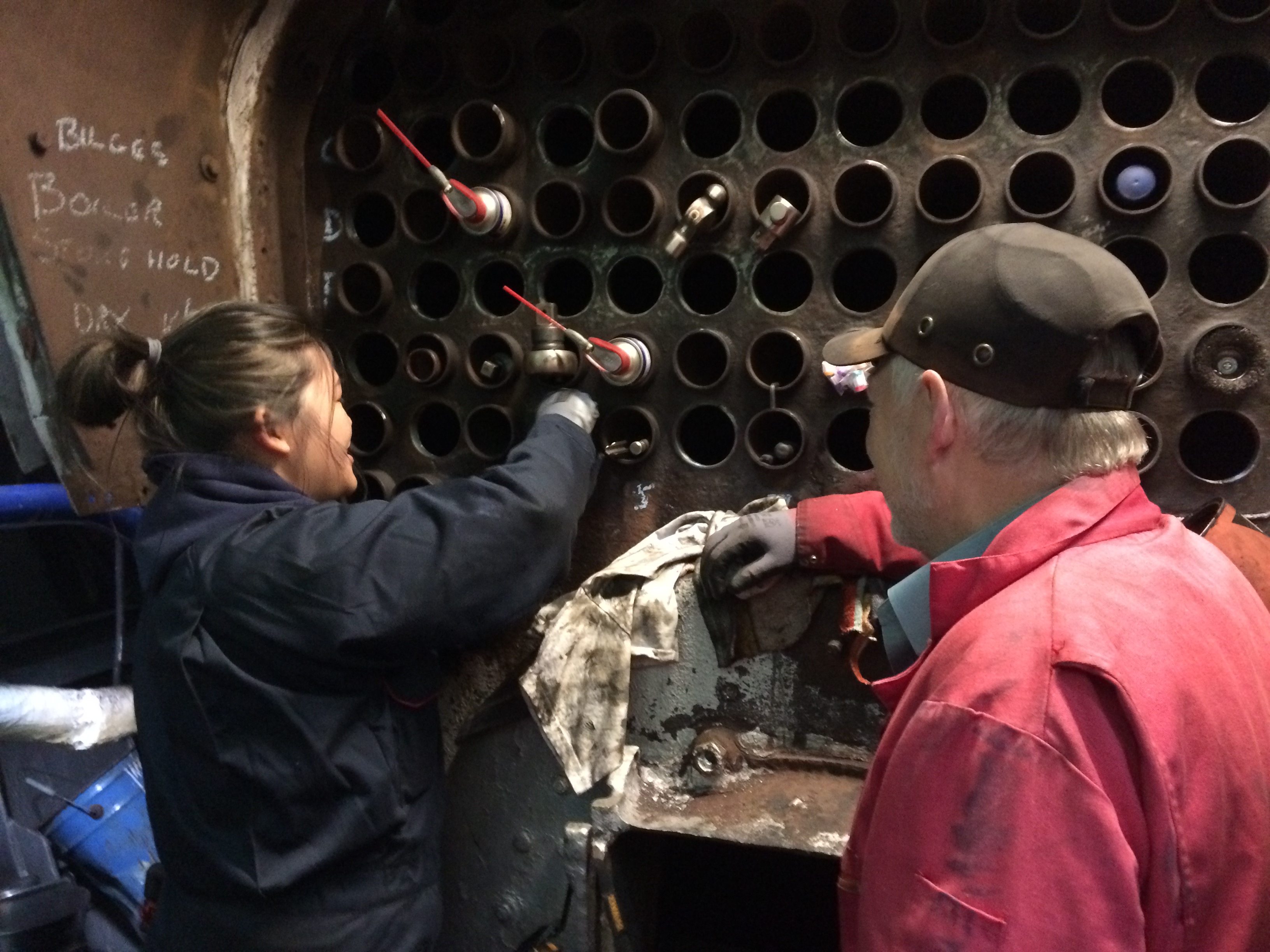 One of the Steam Tug Kerne Preservation Soc's volunteers working on the boiler tub job in 2019