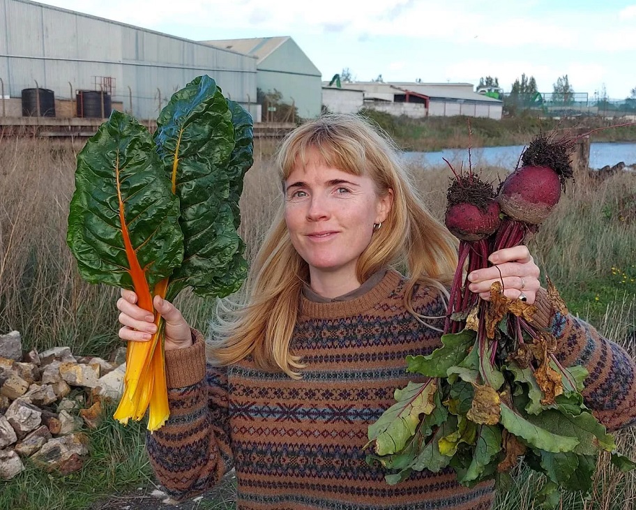 Raybel Community Manager Faye with produce from the community garden