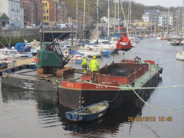 LTC No 6 being loaded with dredgings at Douglas marina