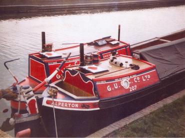 ALPERTON (foreground) - with motor DARLEY. Stern cabin and tiller  from starboard side.
