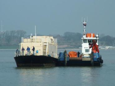LBK6 bow view with tug alongside