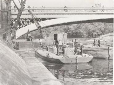 Being towed under a bridge