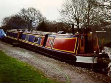 SHIRLEY - on the mooring on the Slough Arm, Grand Union Canal, Inver, Buckinghamshire. Stern from port quarter looking forward.