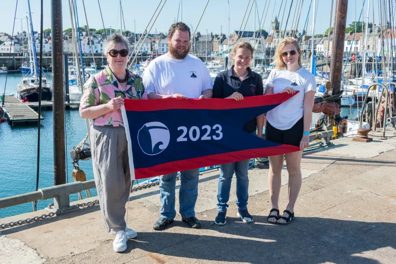 Swan being presented with the Flagship of the Year Award