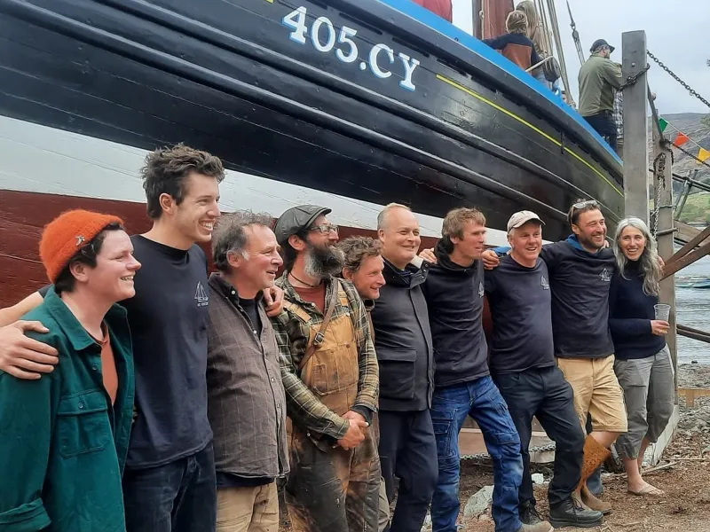 Restoration crew in front of the hull of St Vincent