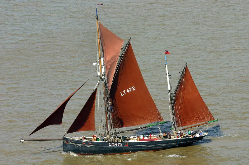 Excelsior under full sail, port side view