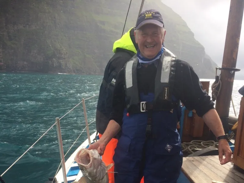 Ian Nicolson posing with a caught fish