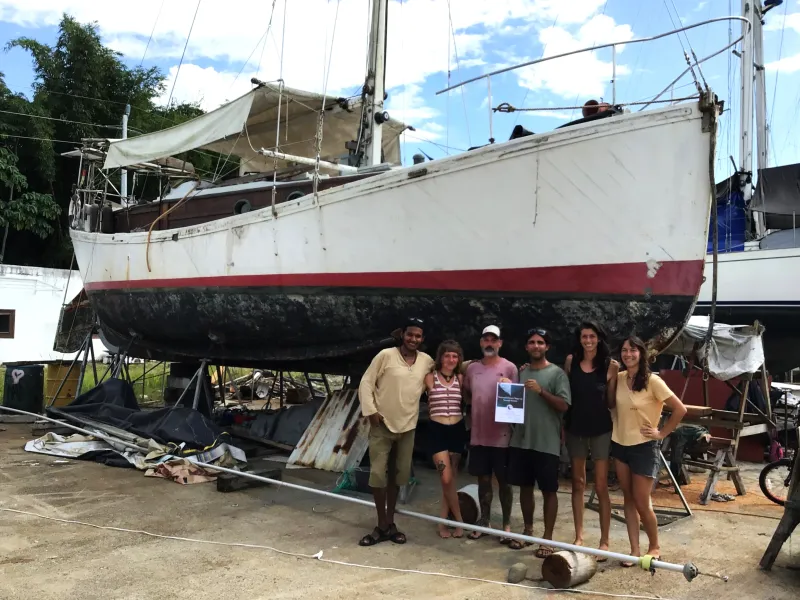 Ambler's friends posing in front of the vessel
