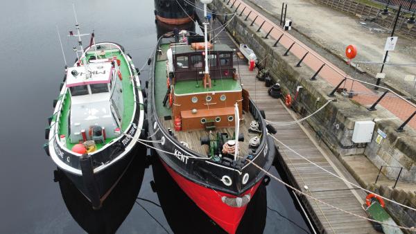 two historic tugs together