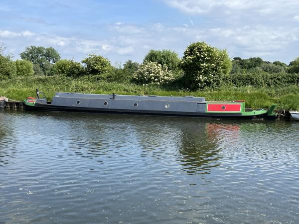 Clyde moored across a canal