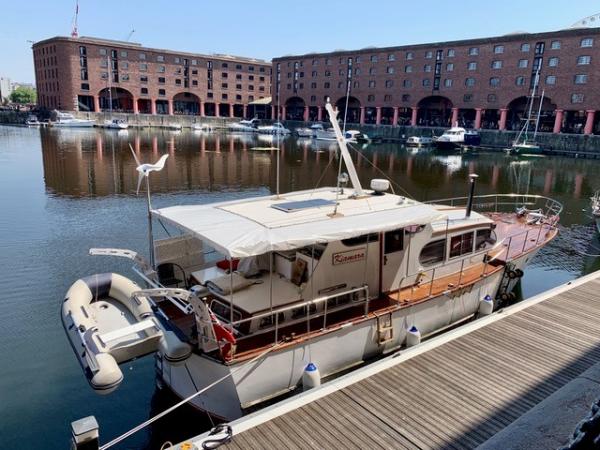 Kiamara moored alongside a pontoon, sternview
