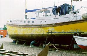 TRIMILIA - hauled out for repainting. Port side from amidships looking forward.