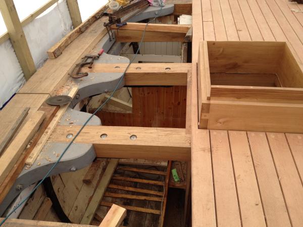 Leader - new deck beams with lodging knees (in grey), a section of the covering board (far left), new forward hatch coaming & a section of new decking