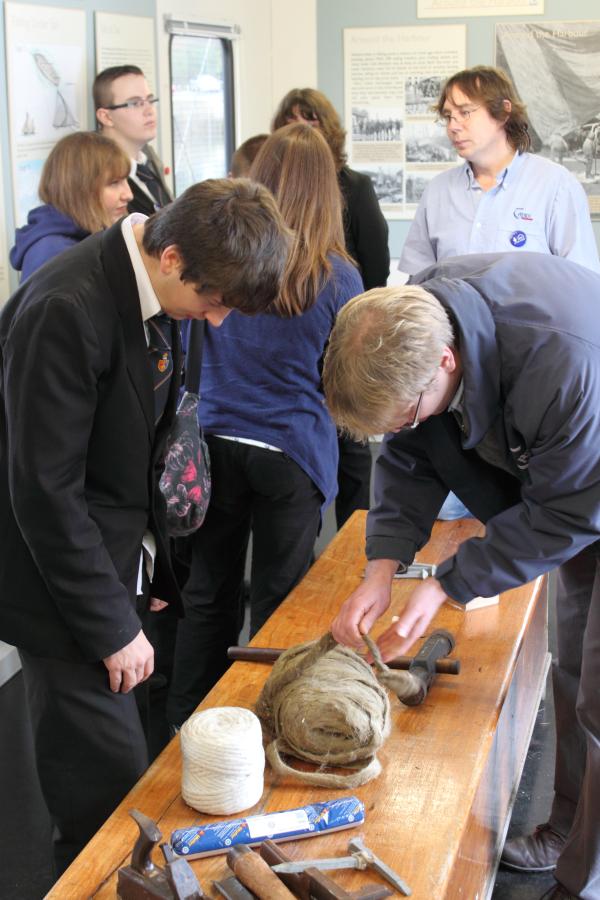 Leader - school students getting a tour of the 'temporary' maritime heritage exhibition centre