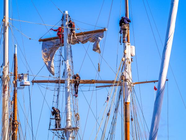 In early April, the sun comes out and the crews of Provident and Lady of Avenel finally get up the masts to prep for the 2023 season