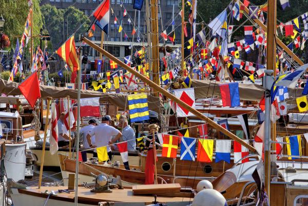 Colourful bunting at the Classic Boat Festival at St Katharine Dock, London.