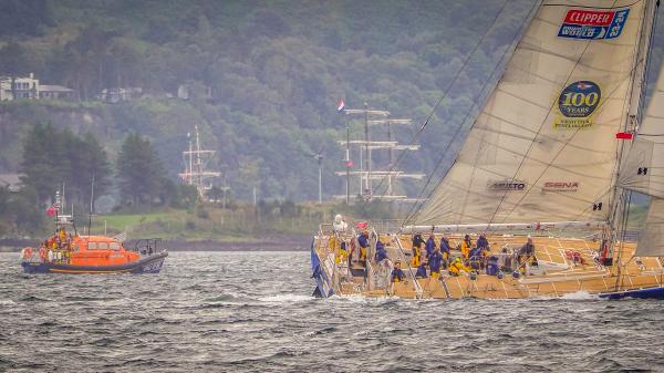 The old and the new. The Clipper race leaves Oban with the masts of tall ship Artemis (1926) and Brigantine Florette (1921) in the background