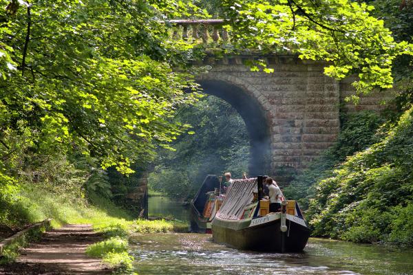 Shroppie Fly Boat Saturn under tow from former FMC motor boat Emu along the Shropshire Union Canal at Brewood.
