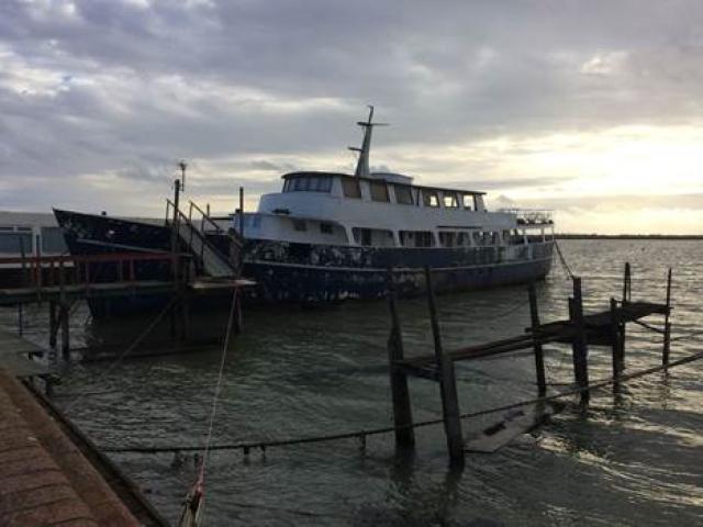 Llys-Helig moored in Burnham-on-Crouch with additional superstructure added to create large upper deck (now being removed)