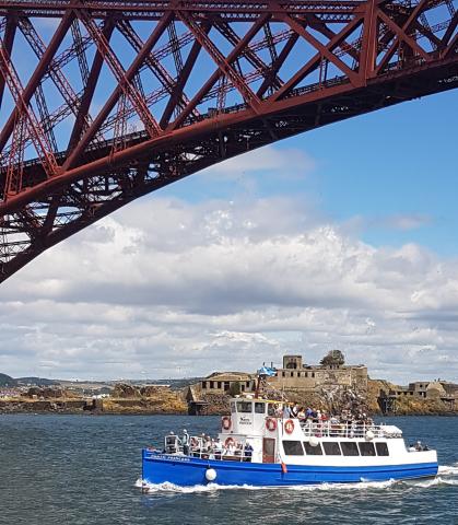 Forth Princess cruising under Forth Bridge