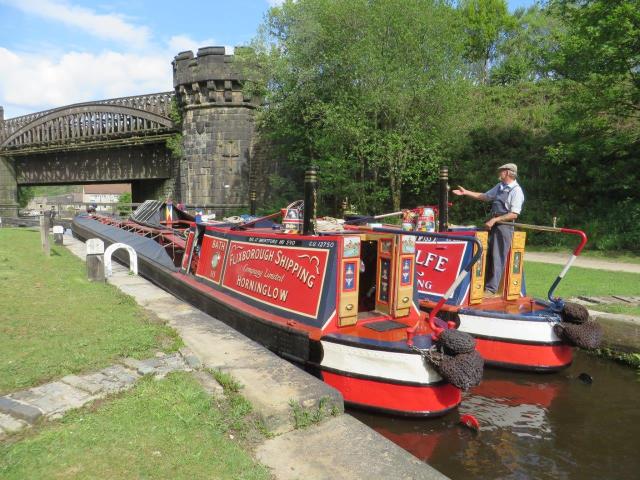 the Rochdale Canal on 17th May 2019 with NB Aldgate and Gauxholme Viaduct in the background.