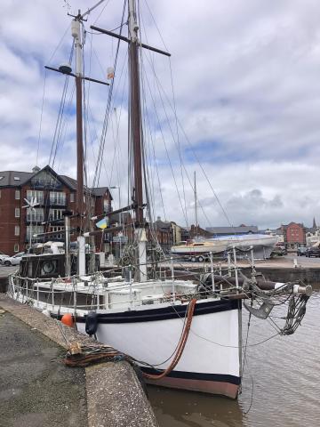 View of vessel alongside Exeter showing Stbd bow