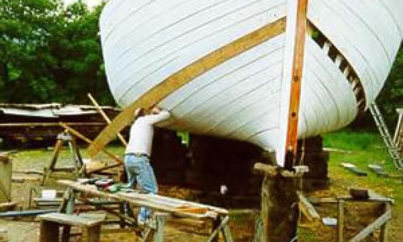 LYNHER - replacing planking with craft on chocks. Bow looking aft