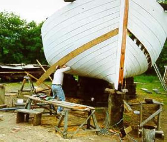 LYNHER - replacing planking with craft on chocks. Bow looking aft