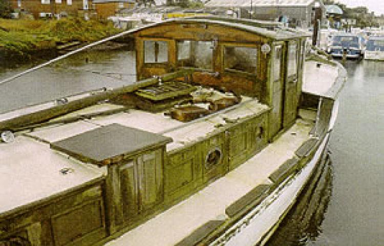 WHITE ASTER II - lying on the Hamble in 1995. Starboard side amidships looking forward.