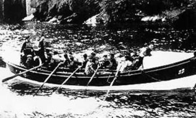 RYDER - being rowed back to Looe, date unknown.  Starboard side.