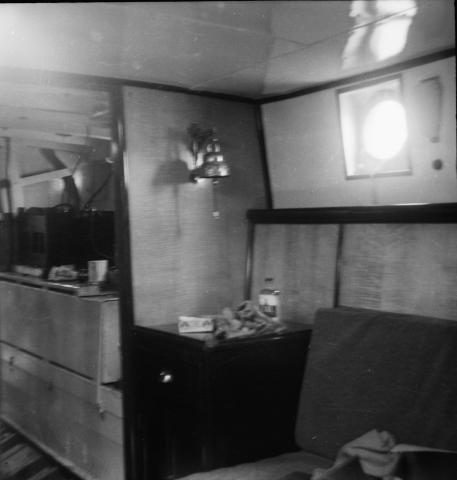 Kami-No-Michi: Interior below decks showing ship's bell and maple cabin partitions