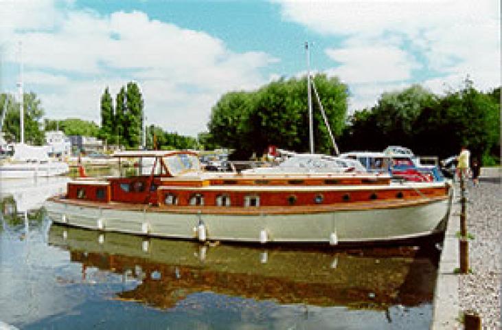 PRINCE OF LIGHT - at mooring. Starboard side. The wheelhouse side is dropped on 'sash window' type weights.