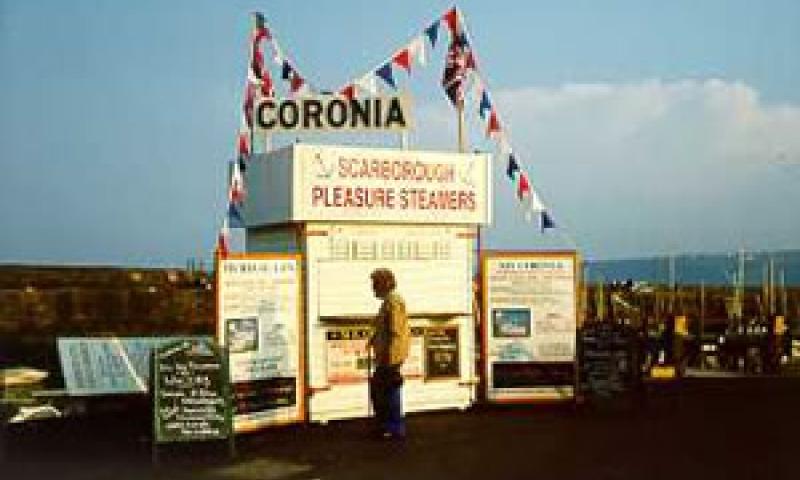 CORONIA - promotion/booking stand on Scarborough harbour wall in May 2000.
