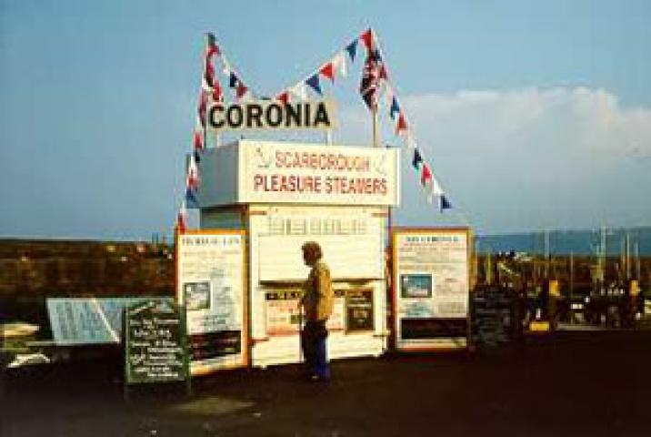 CORONIA - promotion/booking stand on Scarborough harbour wall in May 2000.