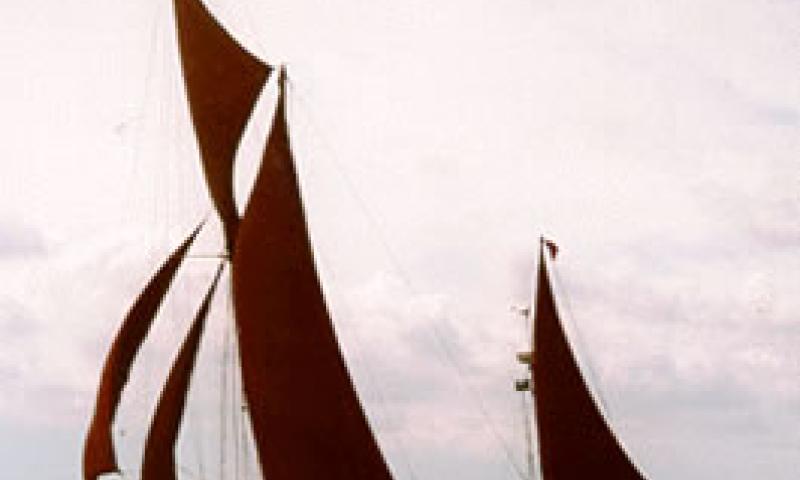 THISTLE - under sail racing in 1997.  Port side.