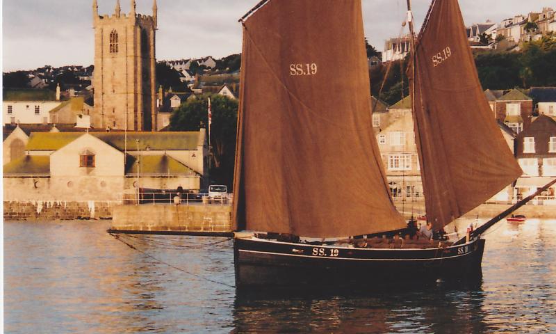 Photo Comp 2012 entry: Ripple -  raising sail in St Ives harbour where she was built 116 years ago