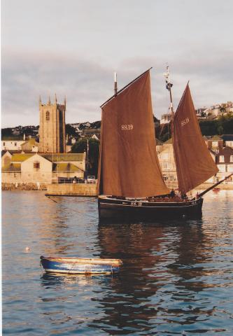 Photo Comp 2012 entry: Ripple -  raising sail in St Ives harbour where she was built 116 years ago