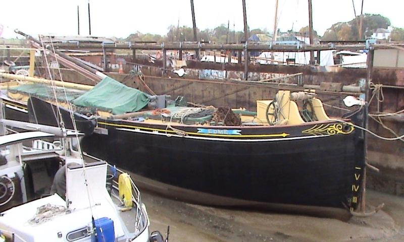 Edme alongside with her mast down