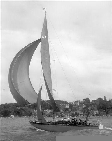 At sea, port side, spinnaker set