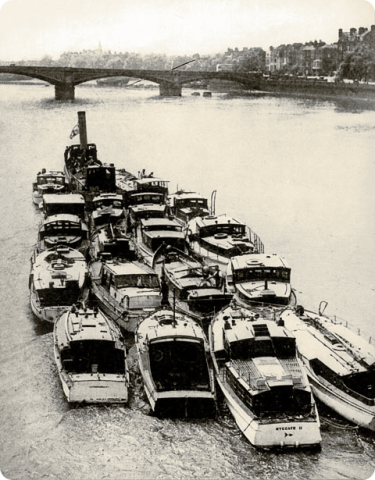 Caretta - on right and fourth boat from bottom, being towed down the Thames in preparation for Dunkirk evacuations