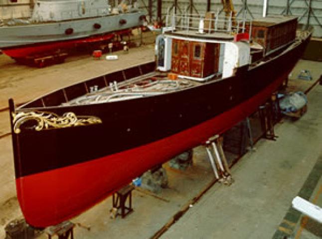 VIGILANT - undercover with work underway. Aerial view of bow and deck from port side looking aft.