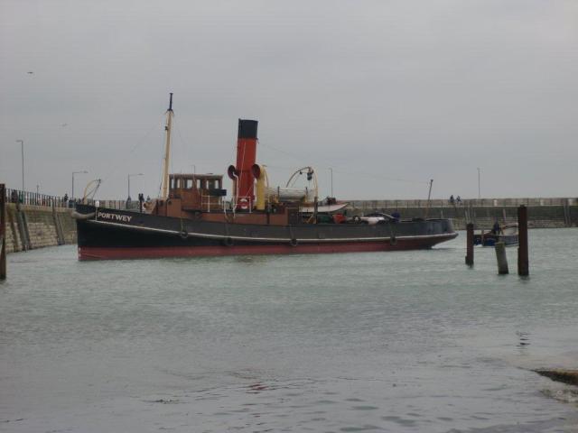 Portwey - afloat and being towed to the Eastern Wall