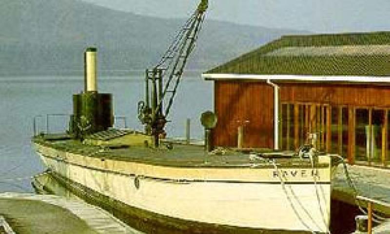 RAVEN moored alongside the quay at the Windermere Steamboat Museum, starboard side showing along deck with crane prominent.
