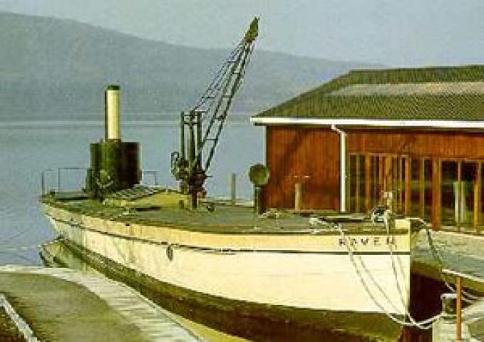 RAVEN moored alongside the quay at the Windermere Steamboat Museum, starboard side showing along deck with crane prominent.