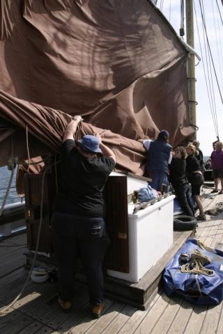 Kenya Jacaranda - stowing the mainsail