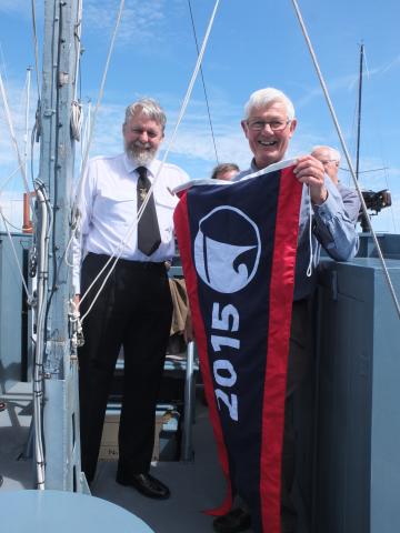 Receiving his pennant